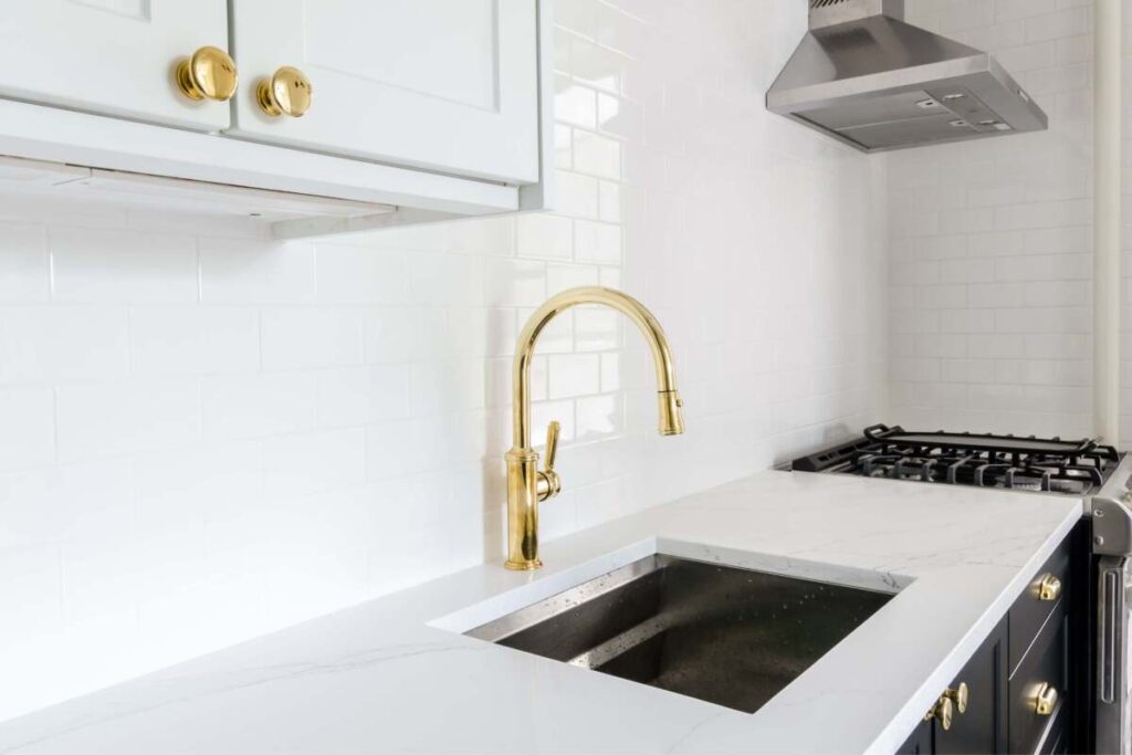 Gold kitchen cabinet pulls and sink