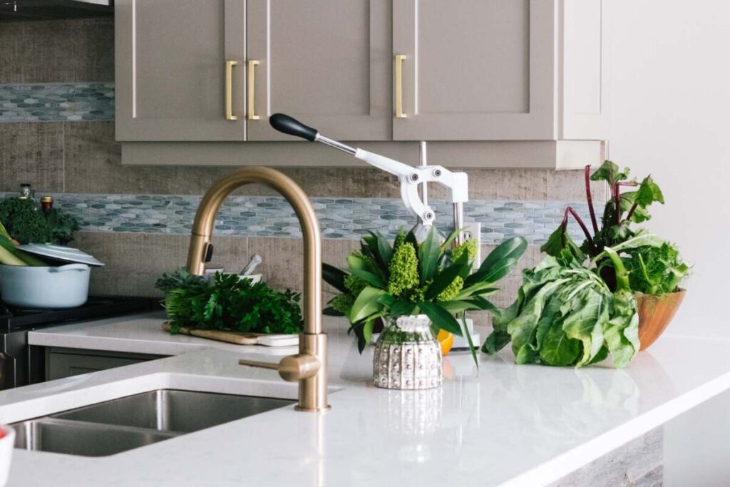 Brass kitchen sink and cabinet pulls