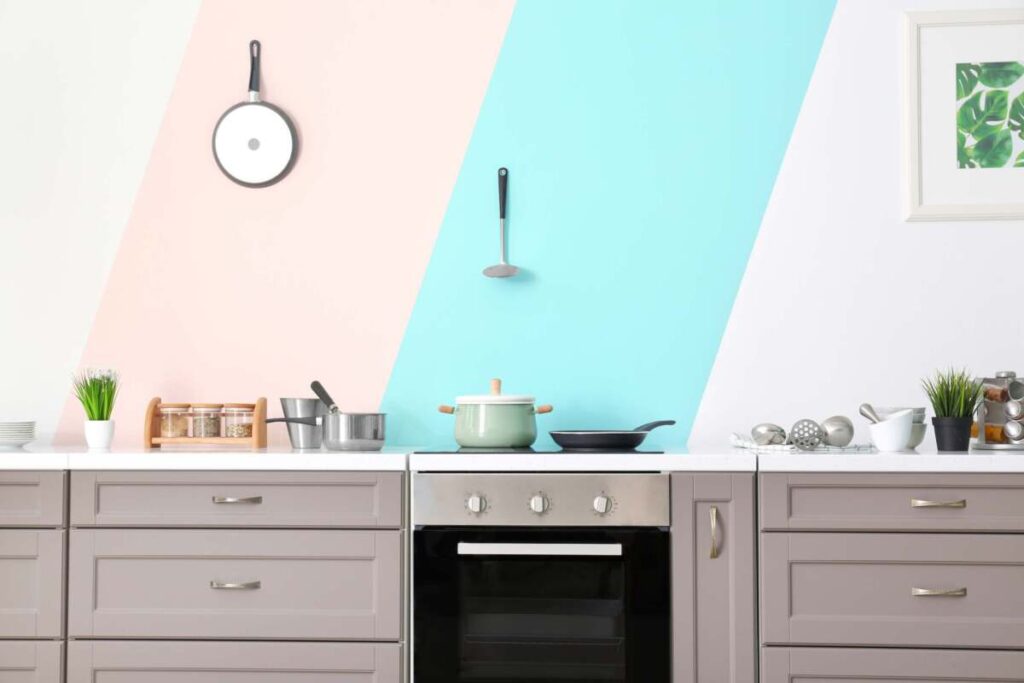 Pink and blue painted kitchen backsplash