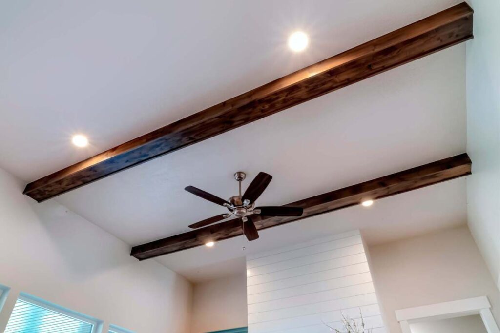 Recessed lighting with wood beams in ceiling