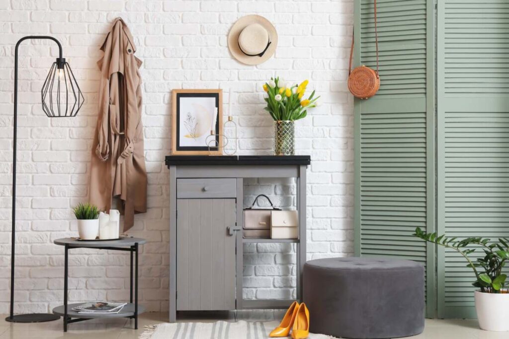 entryway with grey table and ottoman