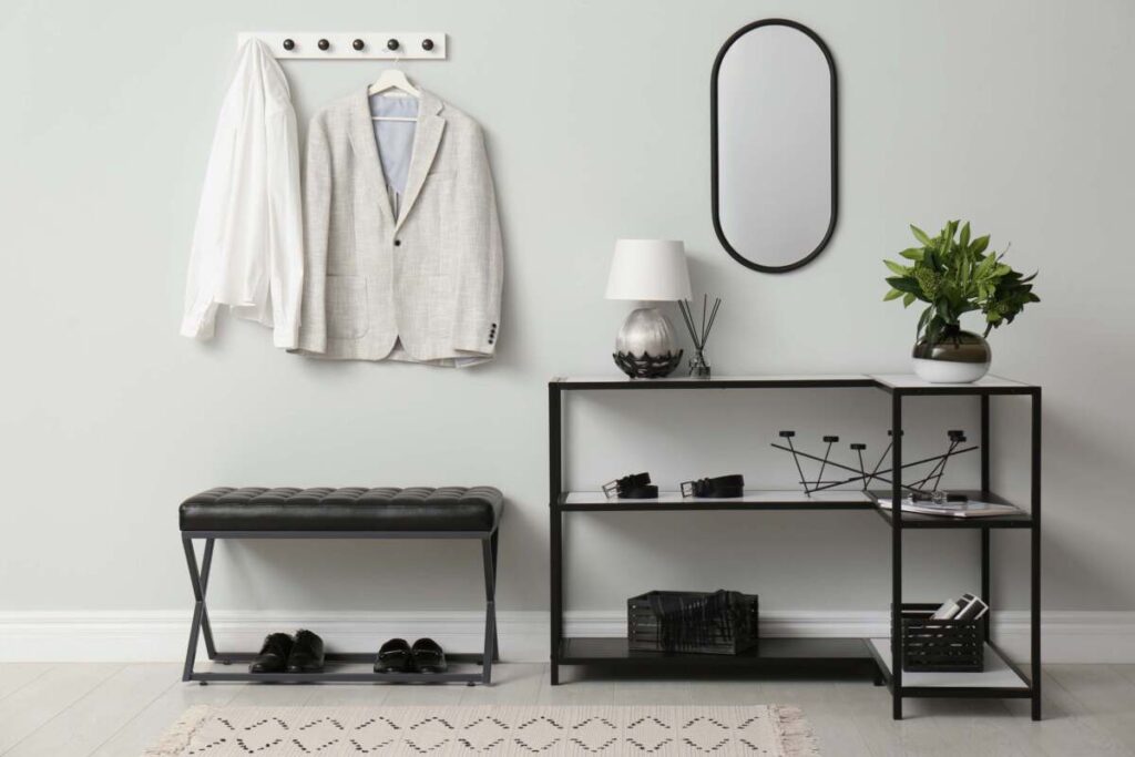 chic black entryway with a small white and silver table lamps