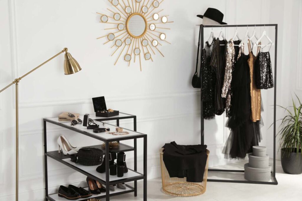 entryway with black wardrobe capsul and show rack with gold floor lamp