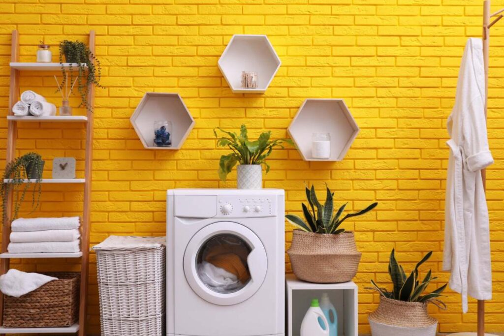laundry room with a yellow brick backsplash